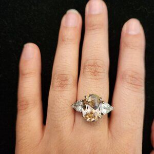 Three-stone pear champagne moissanite ring